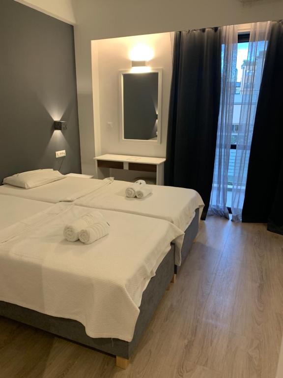 Postel nebo postele na pokoji v ubytování Platon Hotel