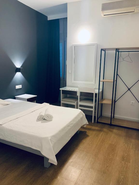 Postel nebo postele na pokoji v ubytování Platon Hotel
