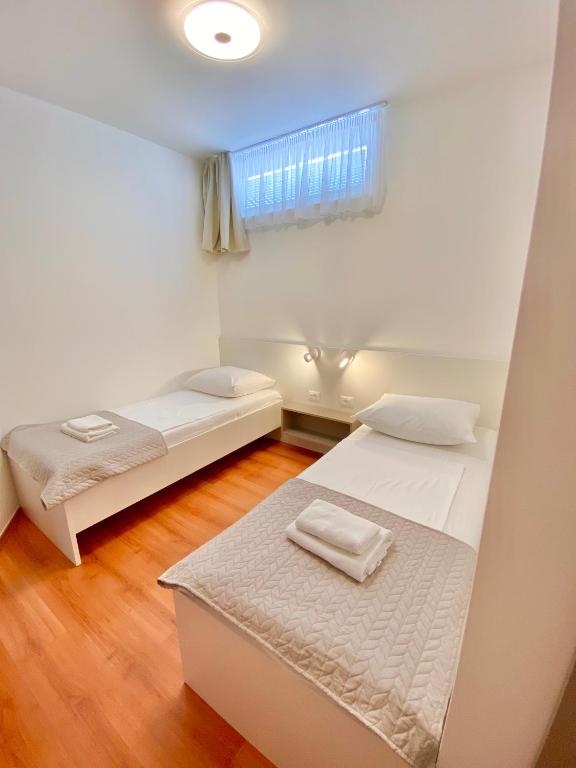 Postel nebo postele na pokoji v ubytování Stipe Residence