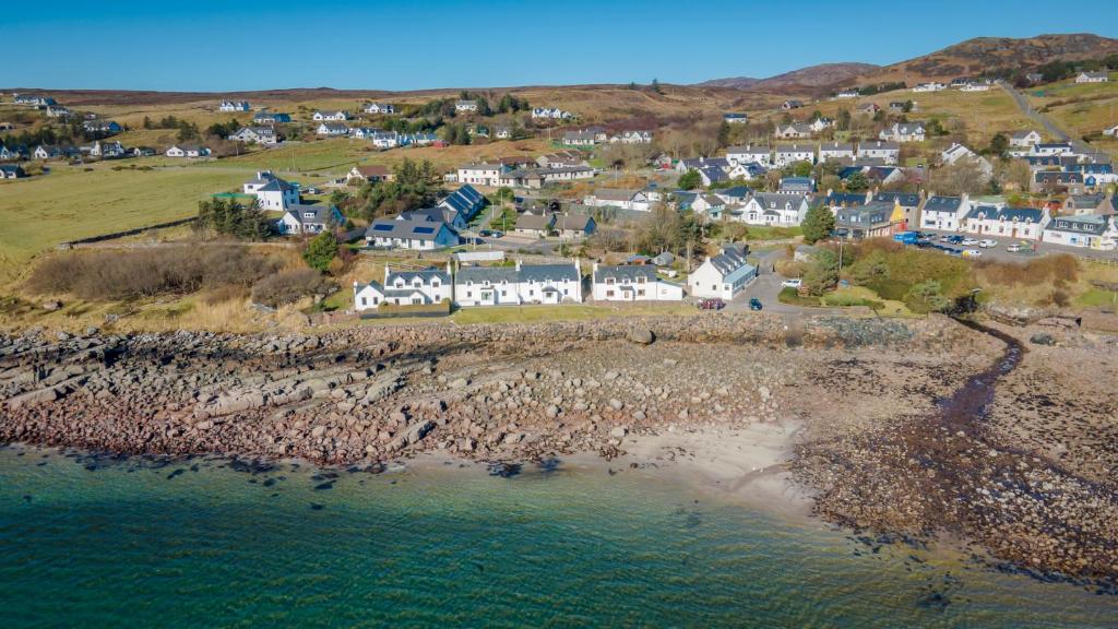 an aerial view of a small town next to the ocean at The Old School House B&B in Gairloch