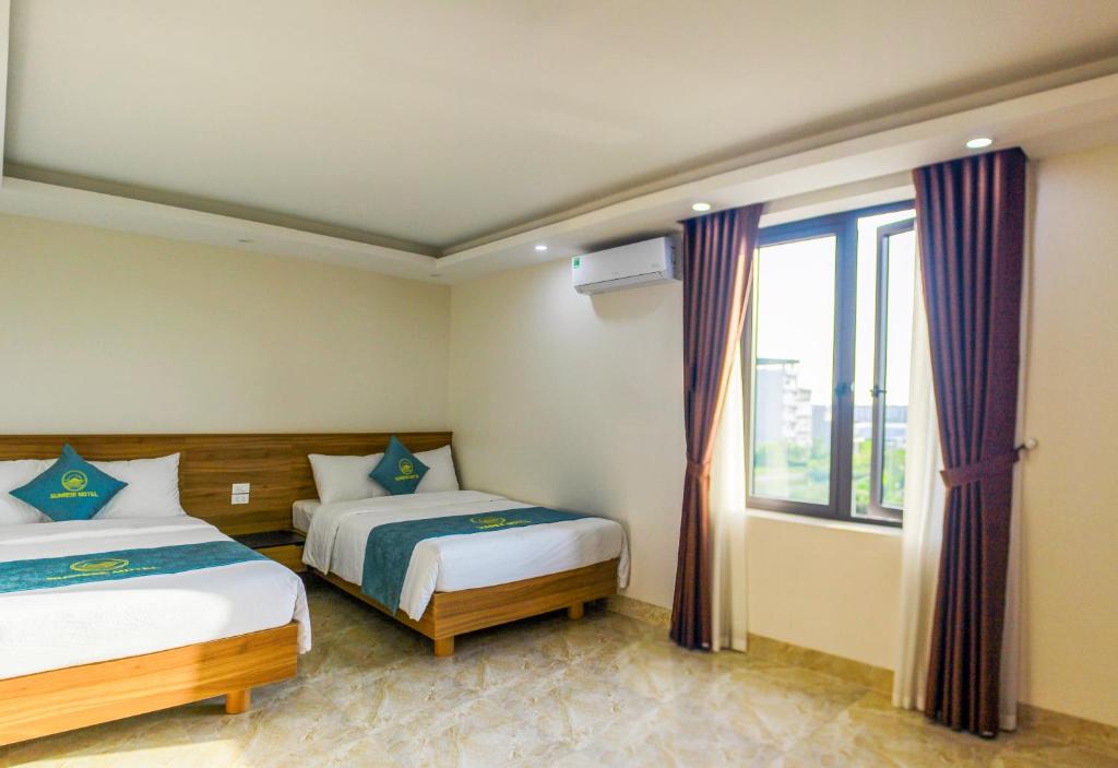 Postel nebo postele na pokoji v ubytování Sunrise Motel