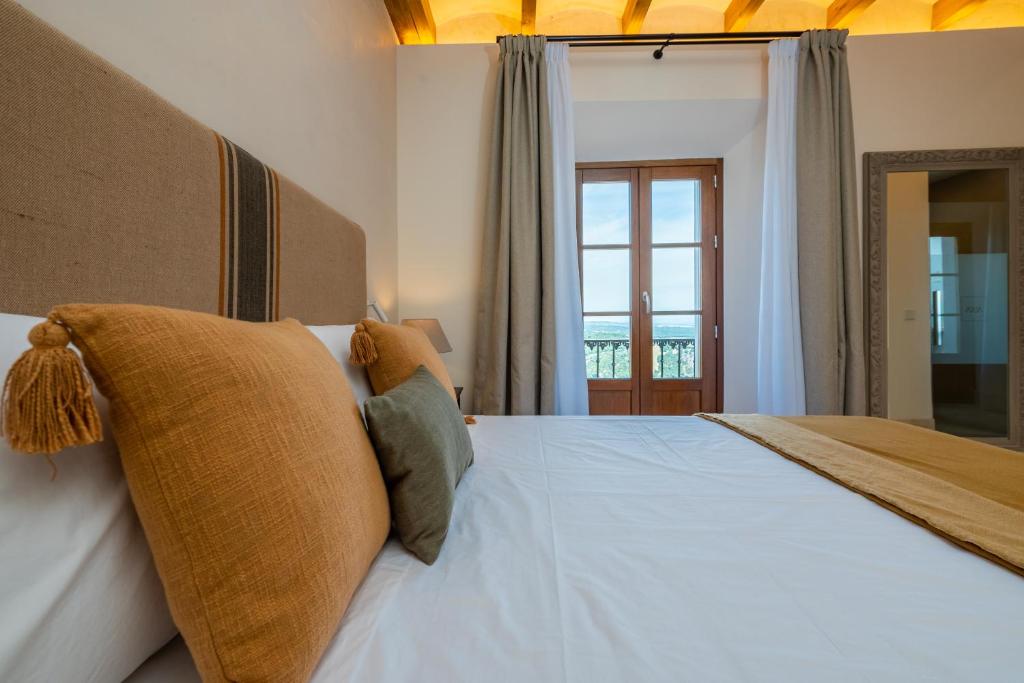 Postel nebo postele na pokoji v ubytování Casa Aura Hotel