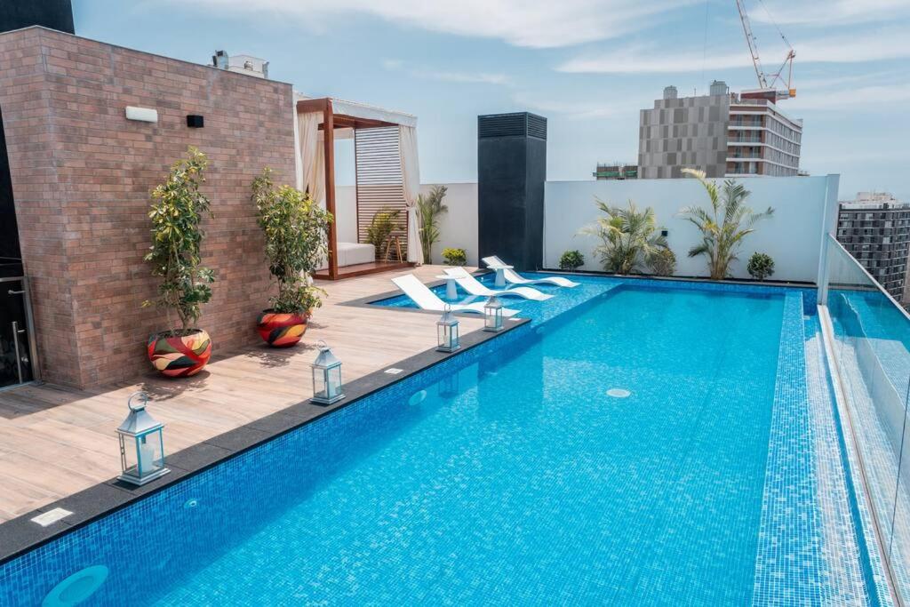 a swimming pool on the roof of a building at NEW Department FULL EQUIP in Barranco POOL and GYM in Lima