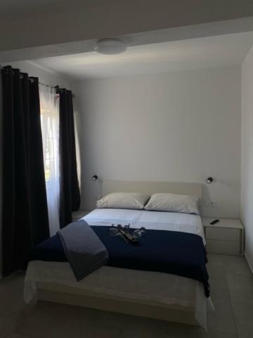 Postel nebo postele na pokoji v ubytování Apartments Marina