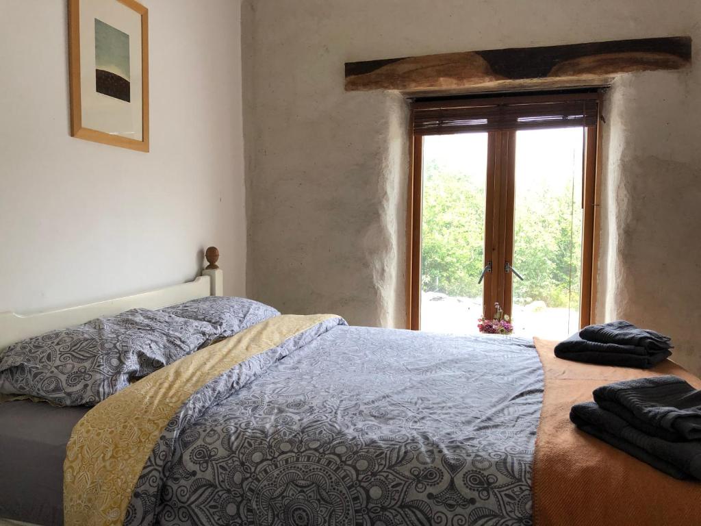 Postel nebo postele na pokoji v ubytování Teach Talamh