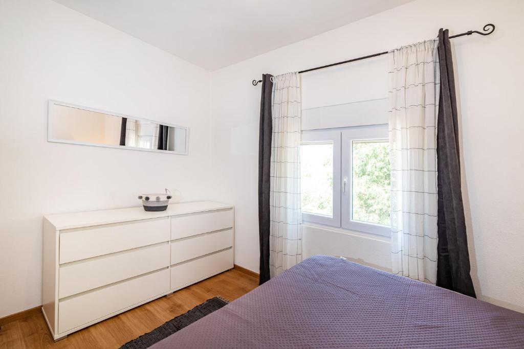 Posteľ alebo postele v izbe v ubytovaní Apartman MISS Pridraga