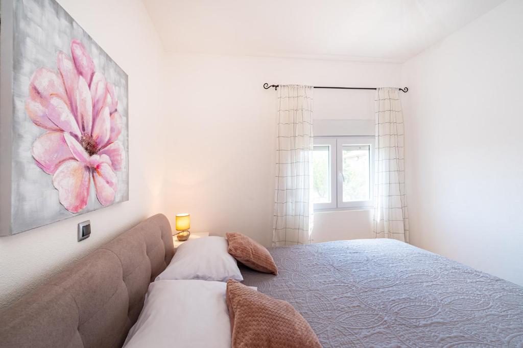 Posteľ alebo postele v izbe v ubytovaní Apartman MISS Pridraga