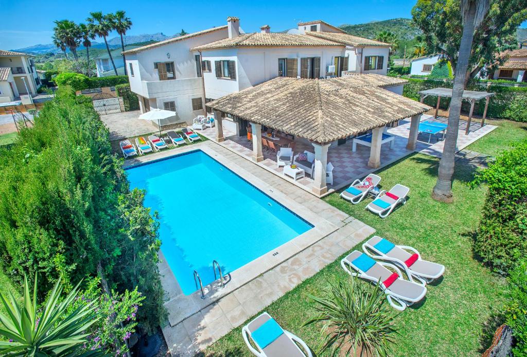 an aerial view of a villa with a swimming pool at Owl Booking Villa Llenaire Gran - 3 min Walk to the Beach in Port de Pollensa