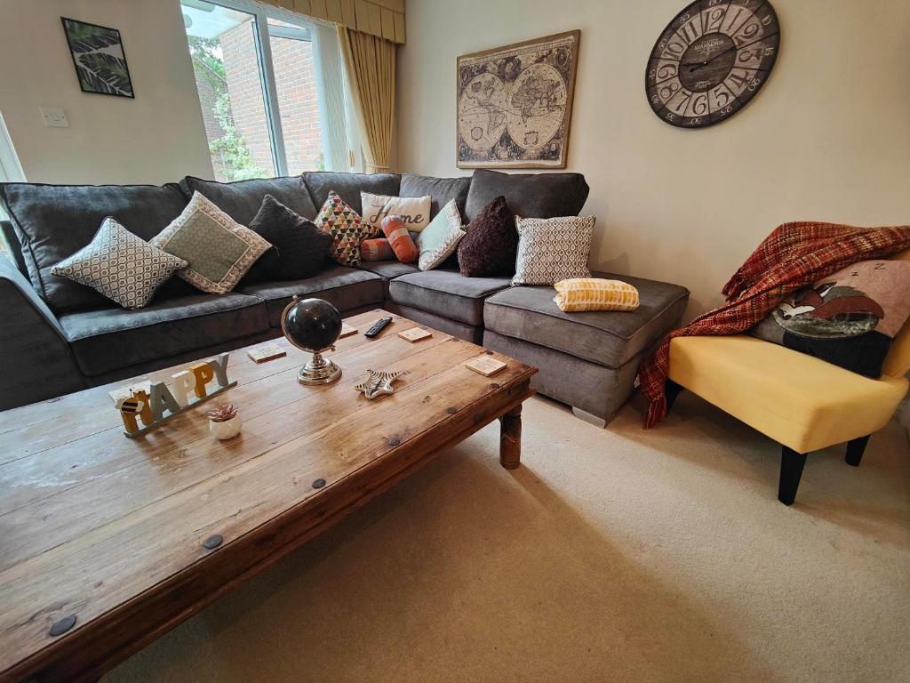 a living room with a couch and a coffee table at Frankland - Emsworth Harbour 3 Bedroom House in Emsworth