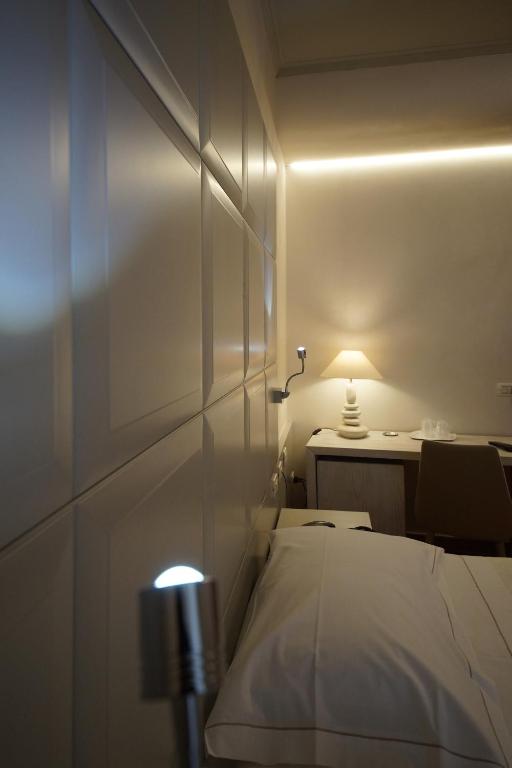 Łóżko lub łóżka w pokoju w obiekcie Albergo Morandi