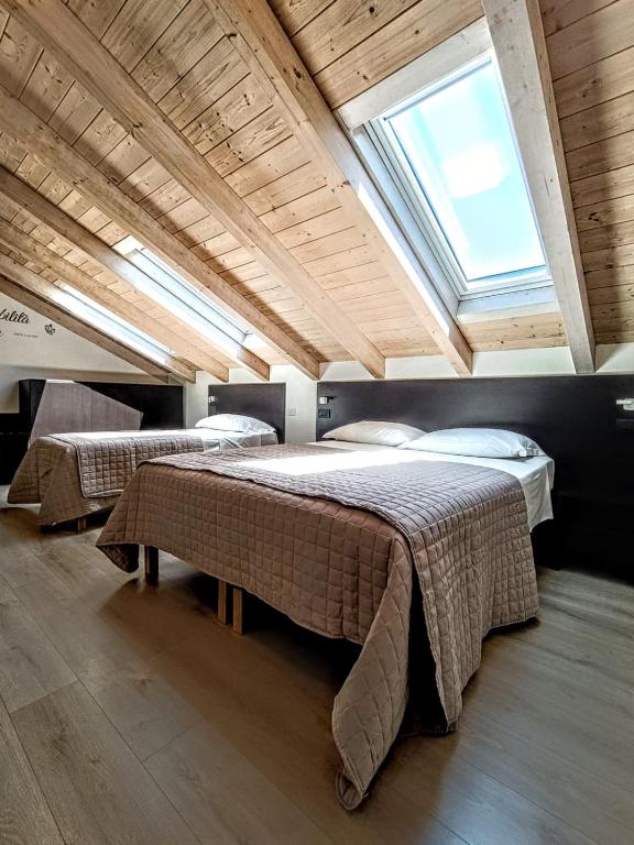 Postel nebo postele na pokoji v ubytování Il B&B di PIAZZA MOTTA