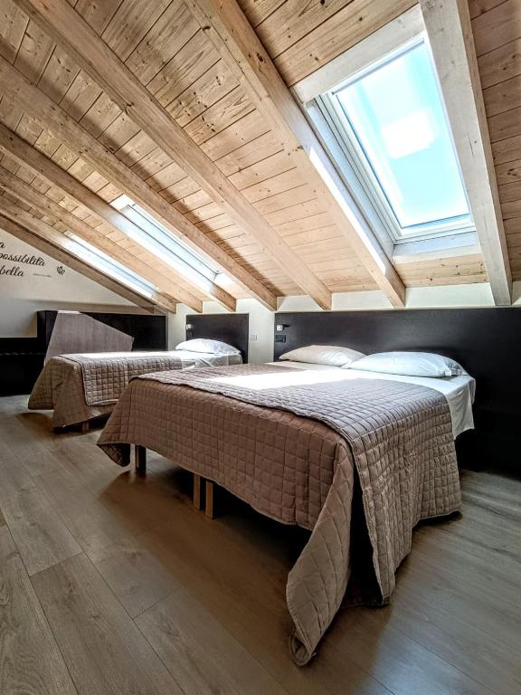 Postel nebo postele na pokoji v ubytování Il B&B di PIAZZA MOTTA