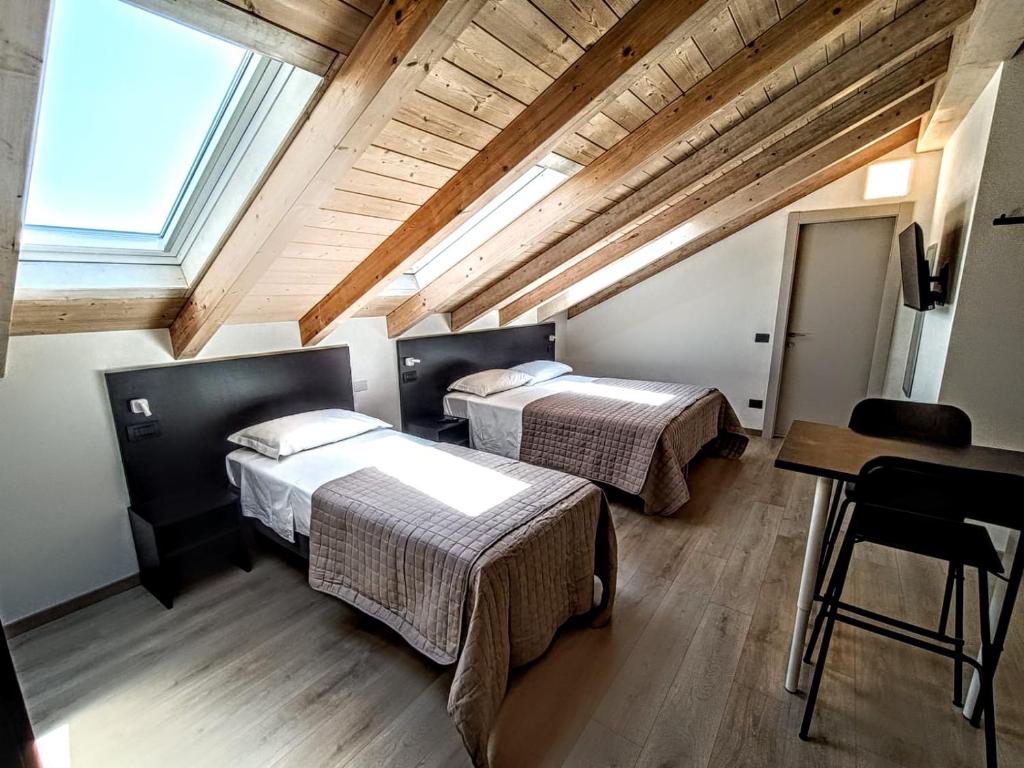 Postel nebo postele na pokoji v ubytování Il B&B di PIAZZA MOTTA