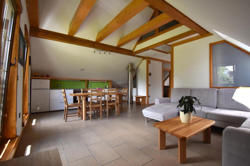 a living room with a couch and a table at Apartma Tima in Bovec