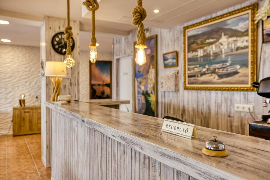 a bar in a restaurant with a sign that says mexico at La Fonda in Cadaqués