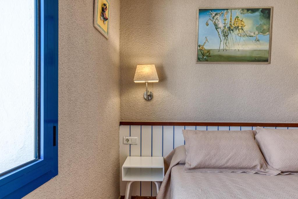 Postel nebo postele na pokoji v ubytování La Fonda