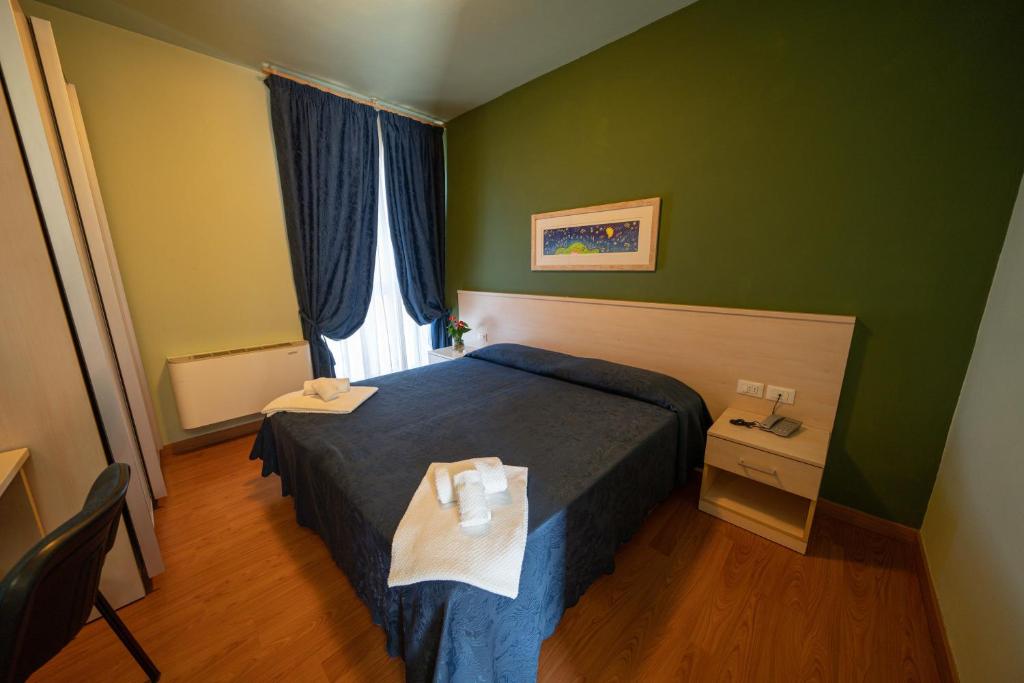 Postel nebo postele na pokoji v ubytování Hotel Break House Ristorante