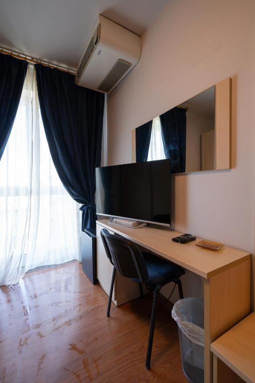 TV a/nebo společenská místnost v ubytování Hotel Break House Ristorante