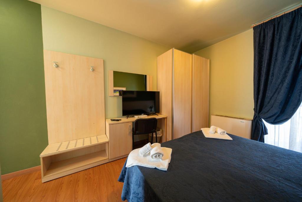 Postel nebo postele na pokoji v ubytování Hotel Break House Ristorante