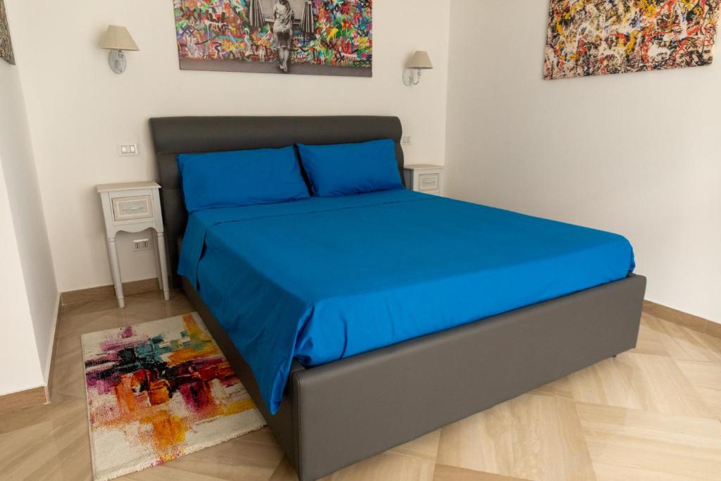A bed or beds in a room at Cozy Loft Putignani