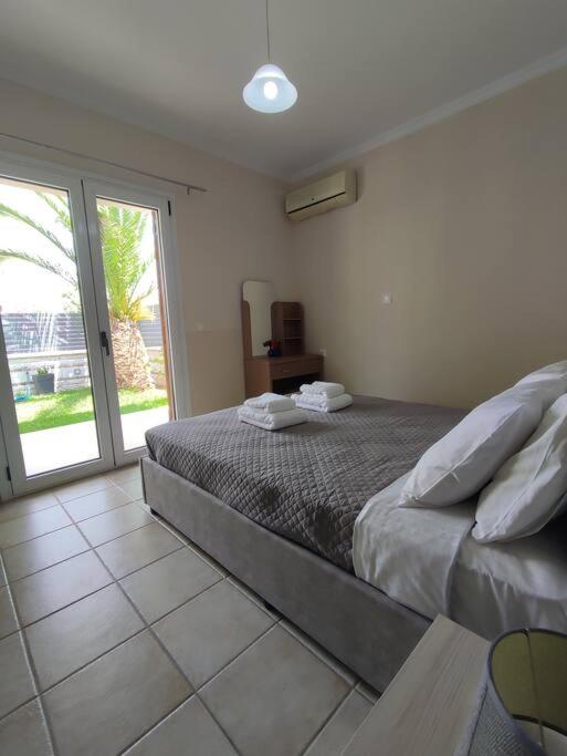 Posteľ alebo postele v izbe v ubytovaní Konomi Residence-Marilena Apartment
