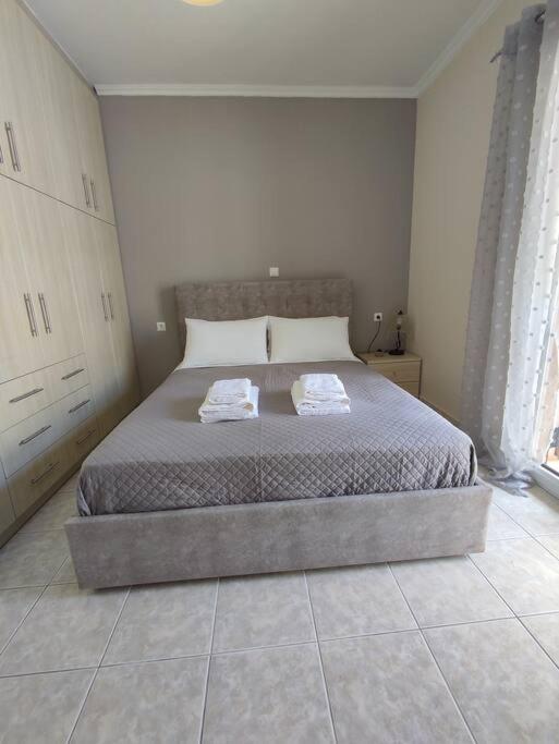 Posteľ alebo postele v izbe v ubytovaní Konomi Residence-Marilena Apartment