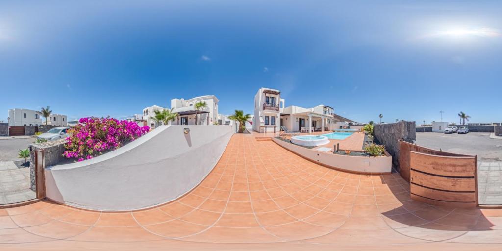 a skateboard ramp on a sidewalk next to a building at Villa Sunset Faro Deluxe & Spa Pool in Playa Blanca