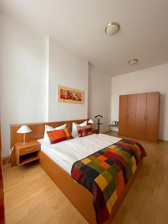 Postel nebo postele na pokoji v ubytování Altwernigeröder Apparthotel