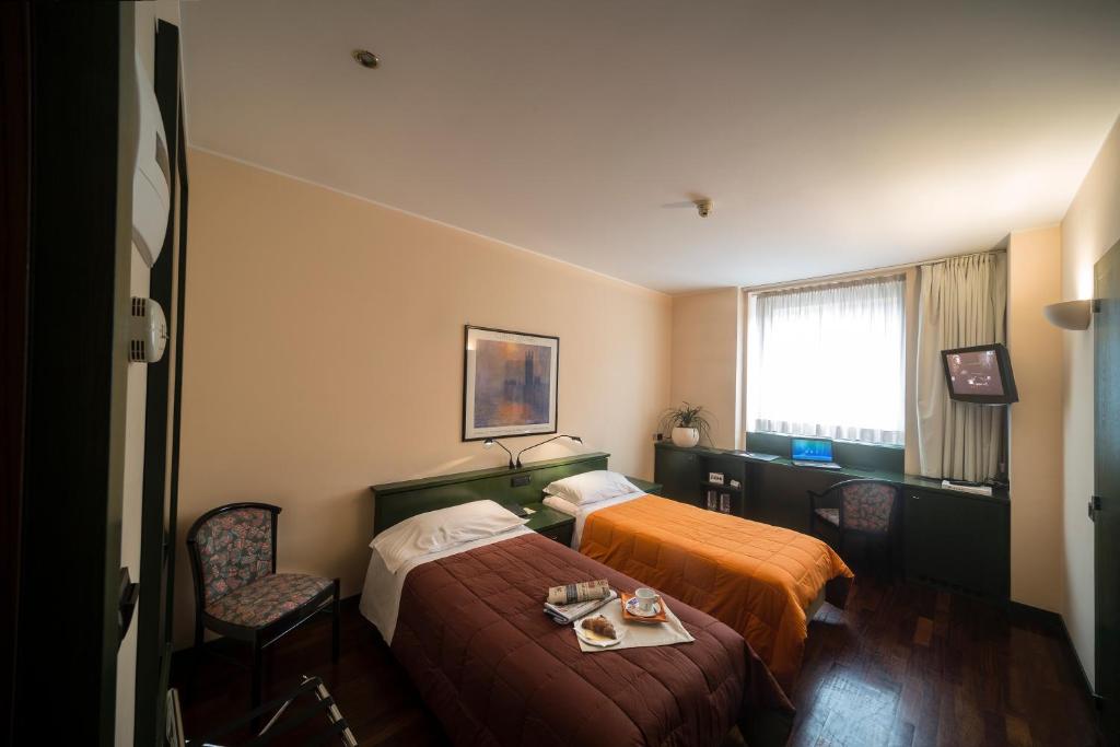 Postel nebo postele na pokoji v ubytování Hotel Del Riale