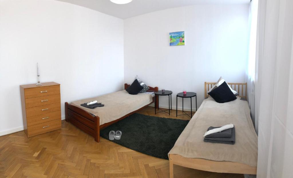 Posteľ alebo postele v izbe v ubytovaní Apartment Świętojerska