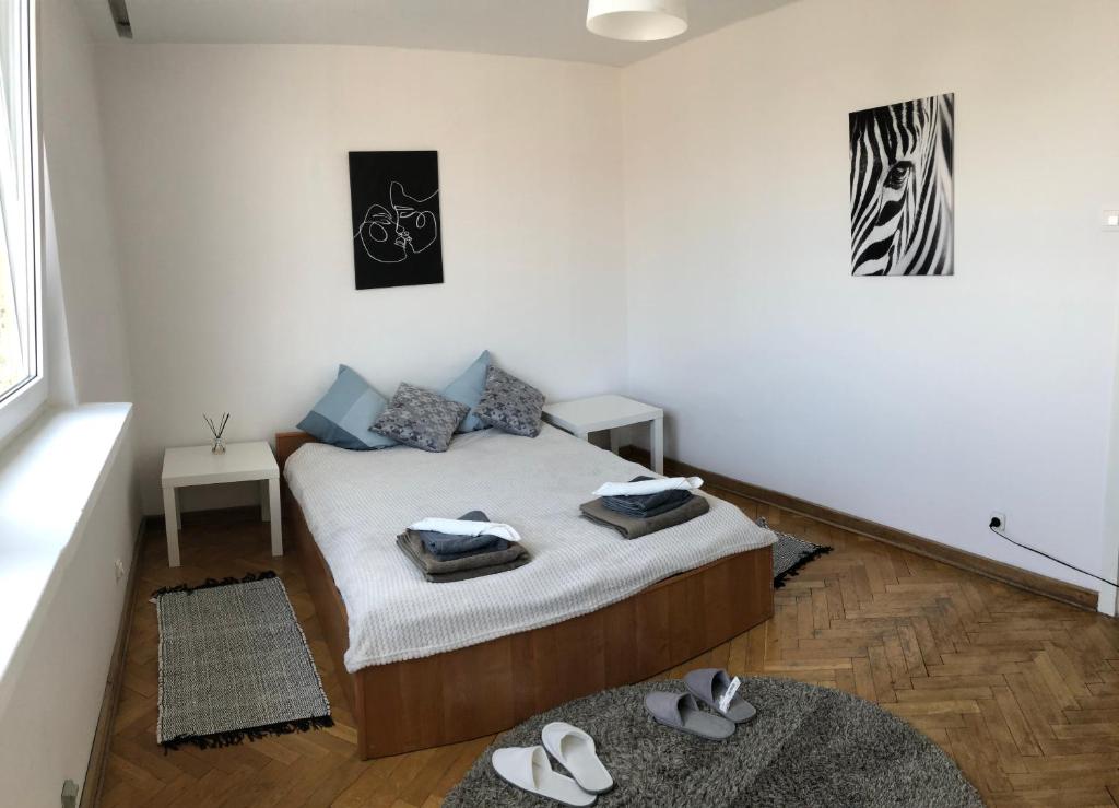 Posteľ alebo postele v izbe v ubytovaní Apartment Świętojerska