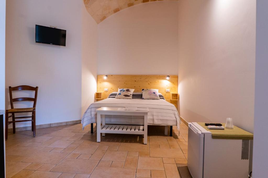 Postel nebo postele na pokoji v ubytování Relais La Giara