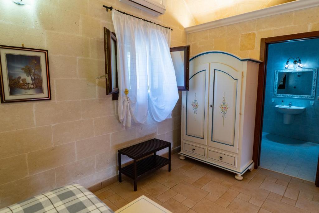Postel nebo postele na pokoji v ubytování Relais La Giara