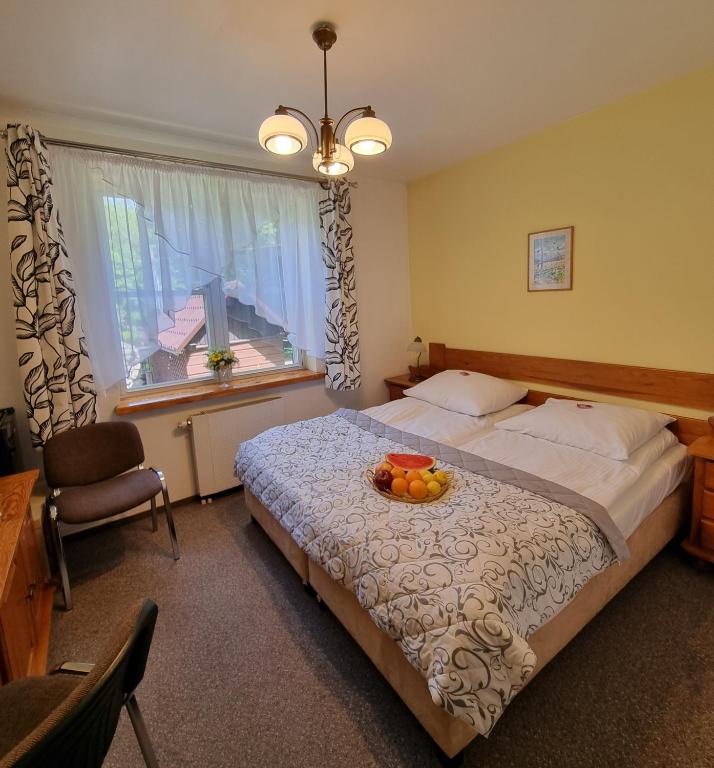 Postel nebo postele na pokoji v ubytování Hotel Karkonosze