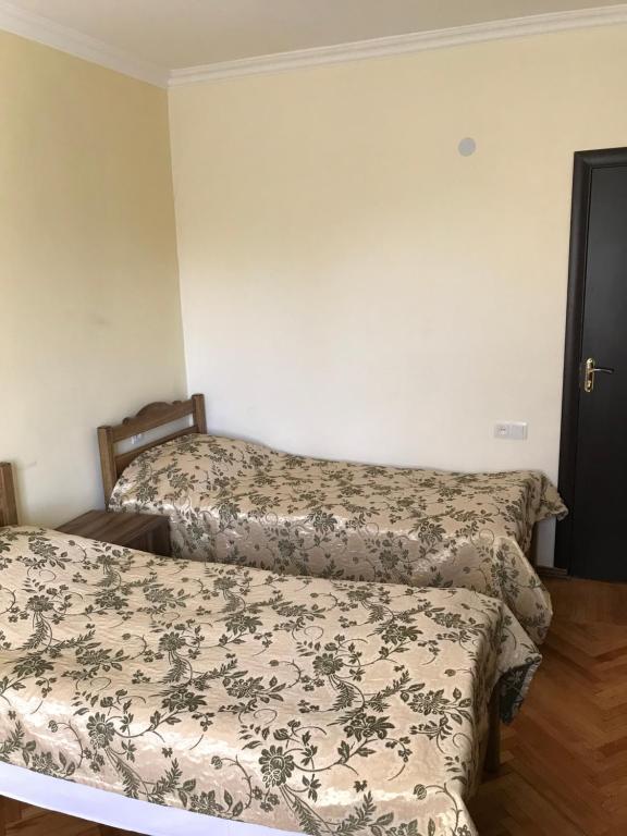 Postel nebo postele na pokoji v ubytování MITANE