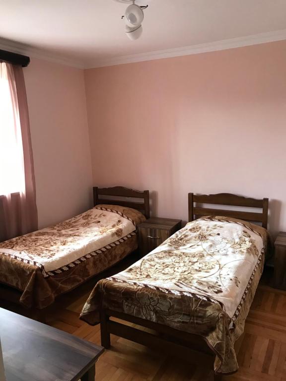 Postel nebo postele na pokoji v ubytování MITANE