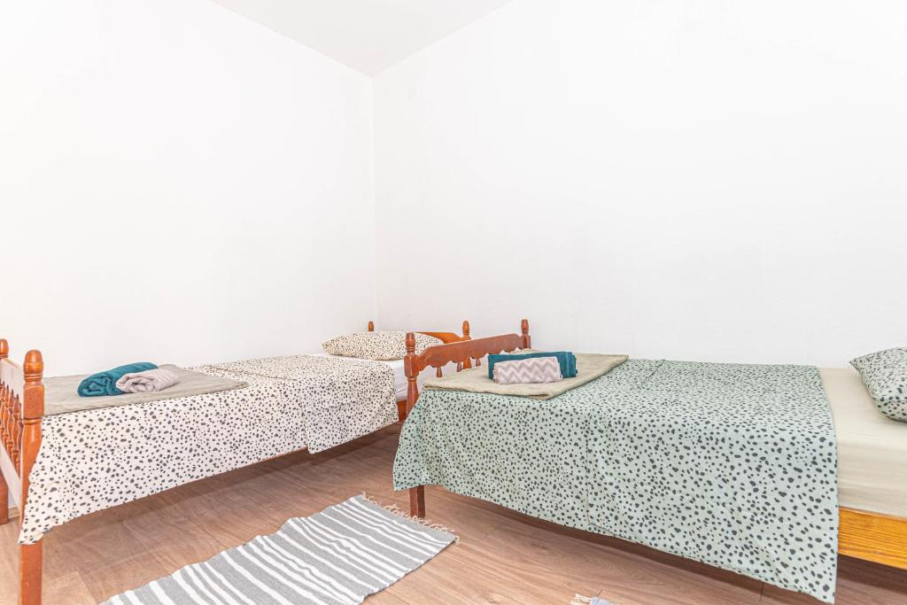 Posteľ alebo postele v izbe v ubytovaní Apartment Nocturno