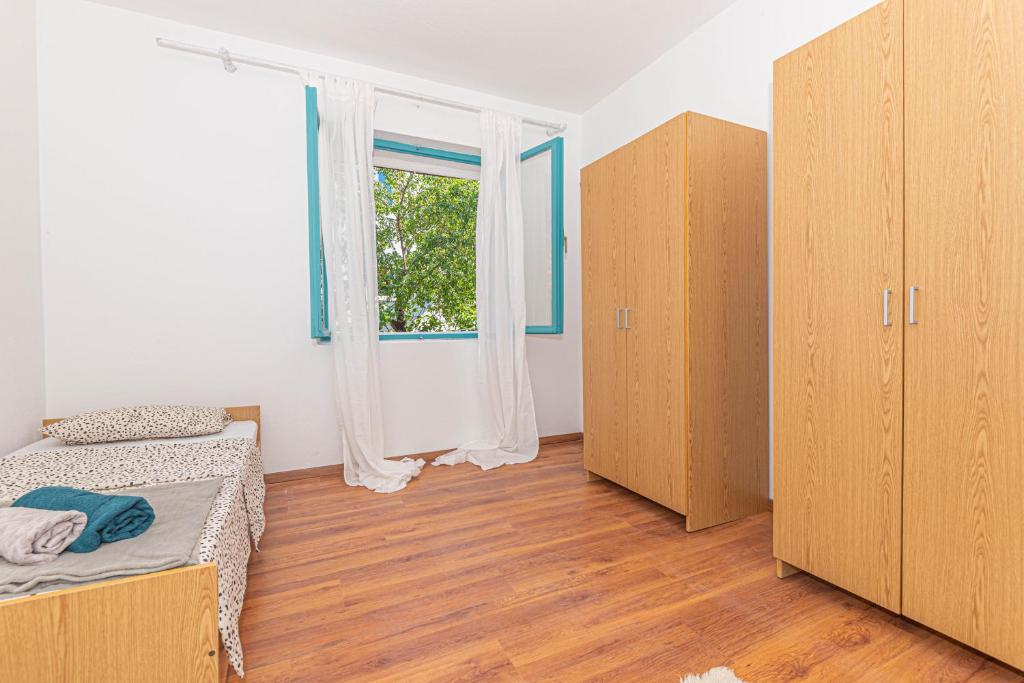 Posteľ alebo postele v izbe v ubytovaní Apartment Nocturno