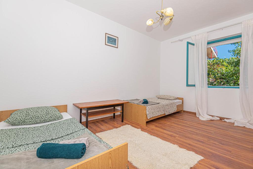 Posteľ alebo postele v izbe v ubytovaní Apartment Nocturno