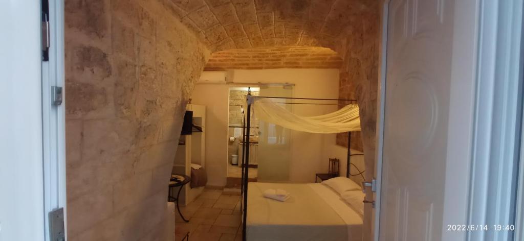 a bathroom with a white tub in a room at Abbazia Degli Svevi in Bari