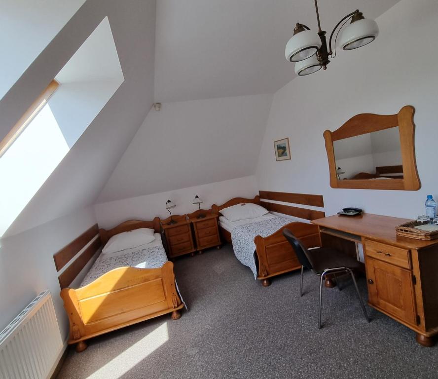 Postel nebo postele na pokoji v ubytování Hotel Karkonosze
