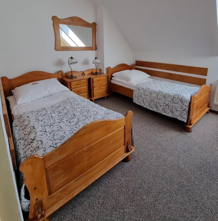 Postel nebo postele na pokoji v ubytování Hotel Karkonosze