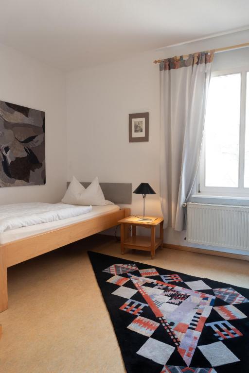 Postel nebo postele na pokoji v ubytování Gästehaus Stadtmitte