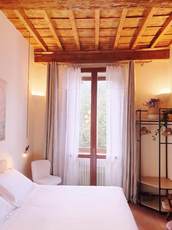 Postel nebo postele na pokoji v ubytování SPIRIT OF FLORENCE Boutique Rooms