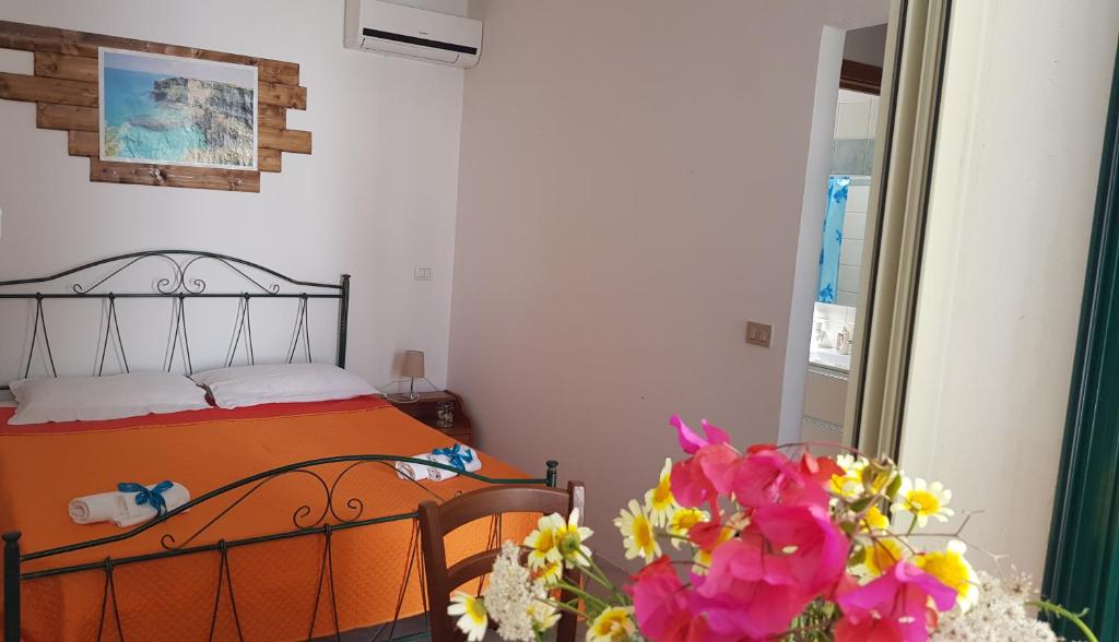 Postel nebo postele na pokoji v ubytování Casa Moniceddhi