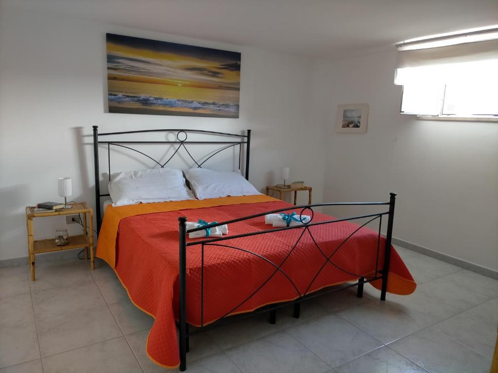 Postel nebo postele na pokoji v ubytování Casa Moniceddhi