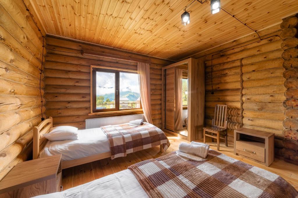 Postel nebo postele na pokoji v ubytování Snow Time Eco Chalet