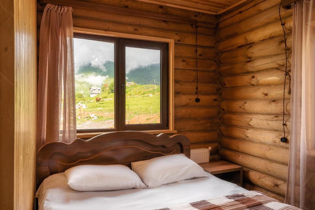 Postel nebo postele na pokoji v ubytování Snow Time Eco Chalet