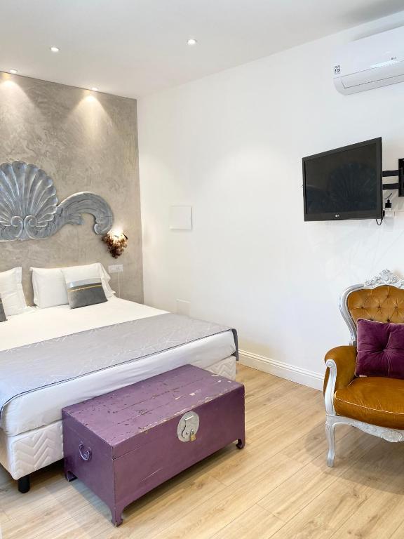 Postel nebo postele na pokoji v ubytování In centro unique rooms