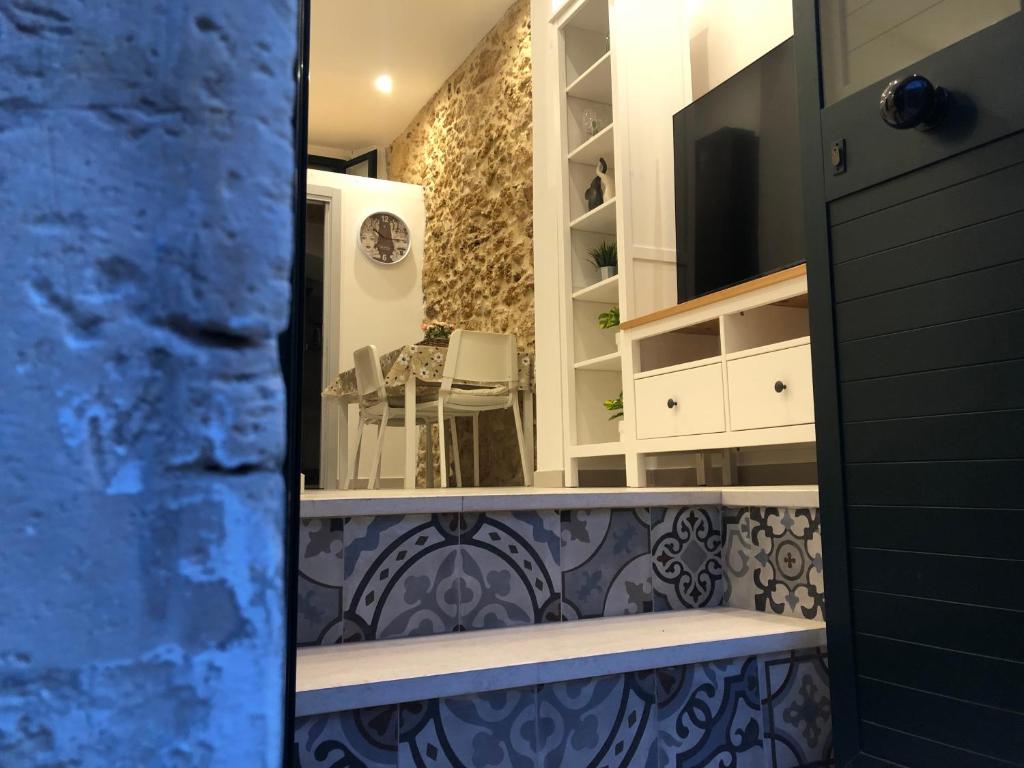 a view of a kitchen with a dining room at Tannur Del Carmine in Noto